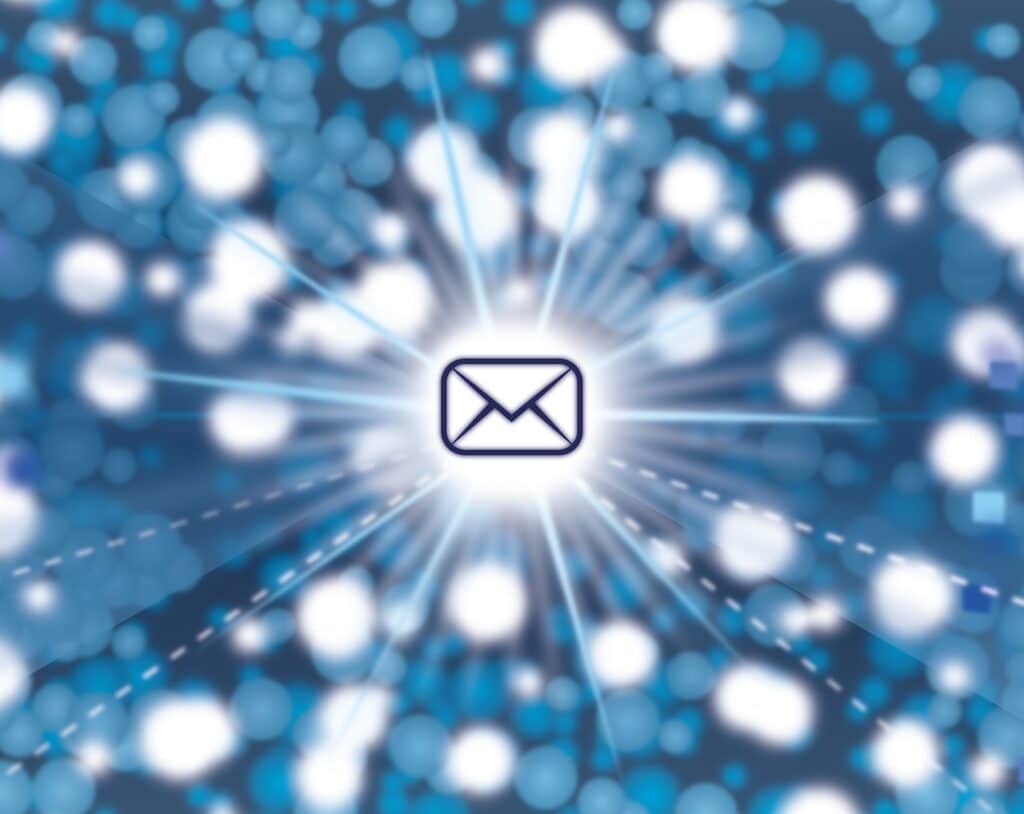 Picture of an envelope over a blue background and lights used as a metaphor for direct mail marketing