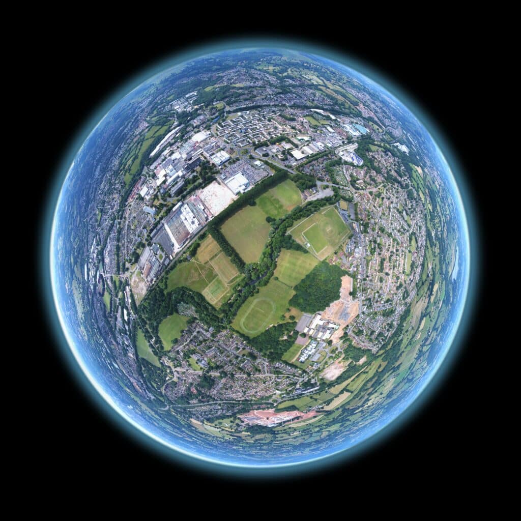 Aerial view of a town reshaped into a globe, symbolizing The visual conveys our dedication to enhancing local engagement, trust, and visibility, key themes discussed in our blog on leveraging local SEO for cleaning businesses
