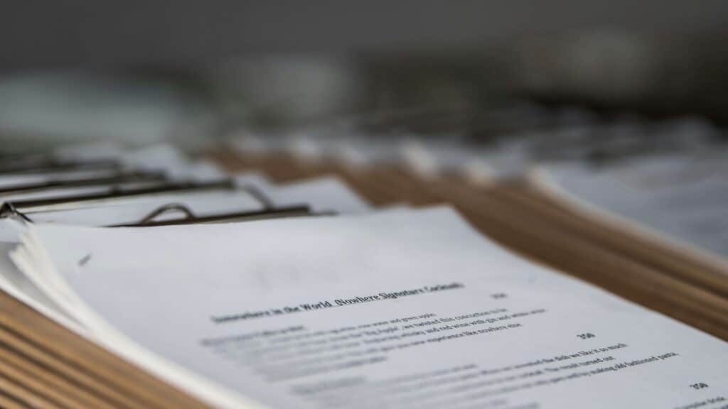 Close-up of multiple clipboards with inspection sheets neatly arranged in a row, representing organized quality control processes.